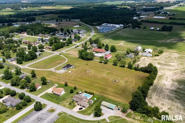 a view of a swimming pool with a yard