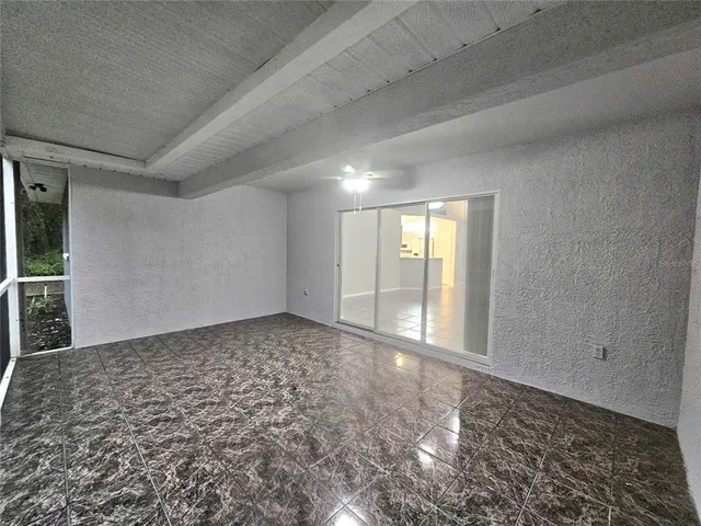 a view of an empty room and window