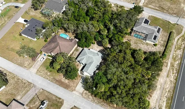 an aerial view of residential building and parking space