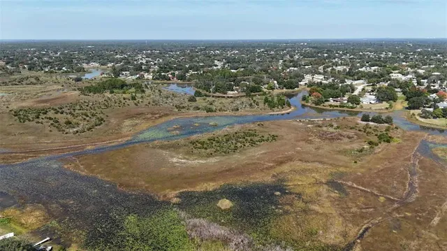 a view of swimming pool from a living room