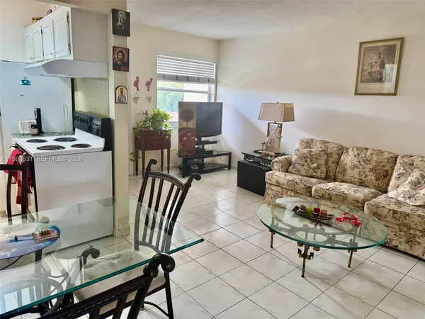 a living room with furniture and a window
