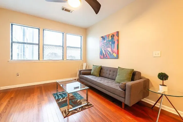 a living room with furniture and a window