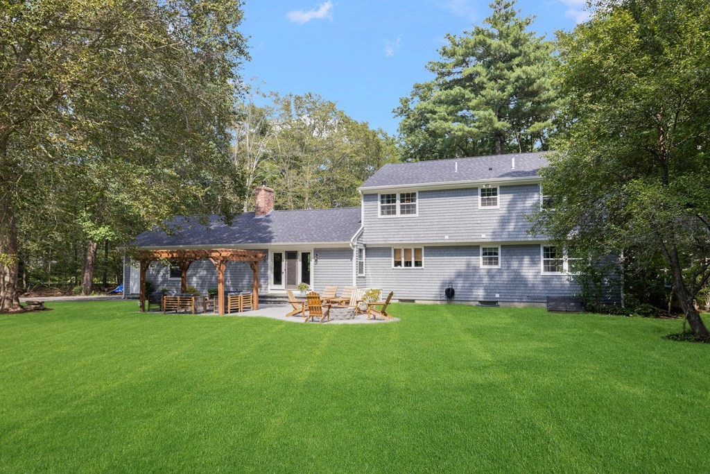164 Rocky Hill Road Rehoboth, MA 02769 - Photo 13 of 42 front view of a house with a yard balcony and trees