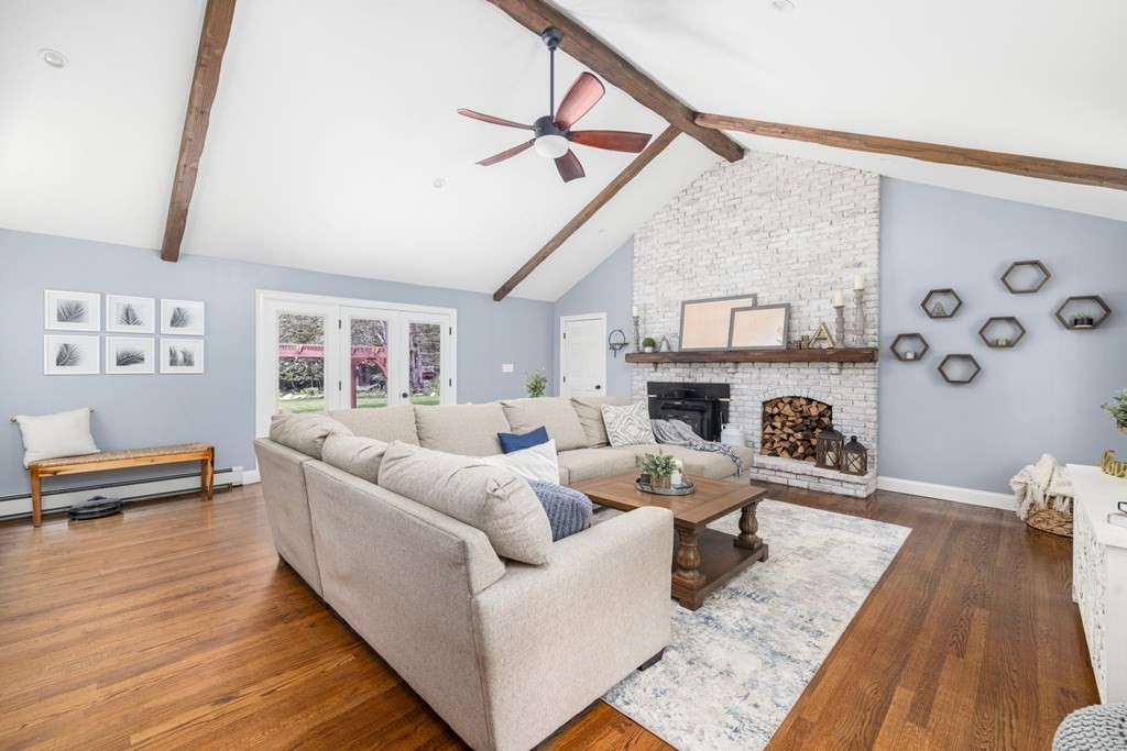 164 Rocky Hill Road Rehoboth, MA 02769 - Photo 16 of 42 a living room with furniture and a fireplace