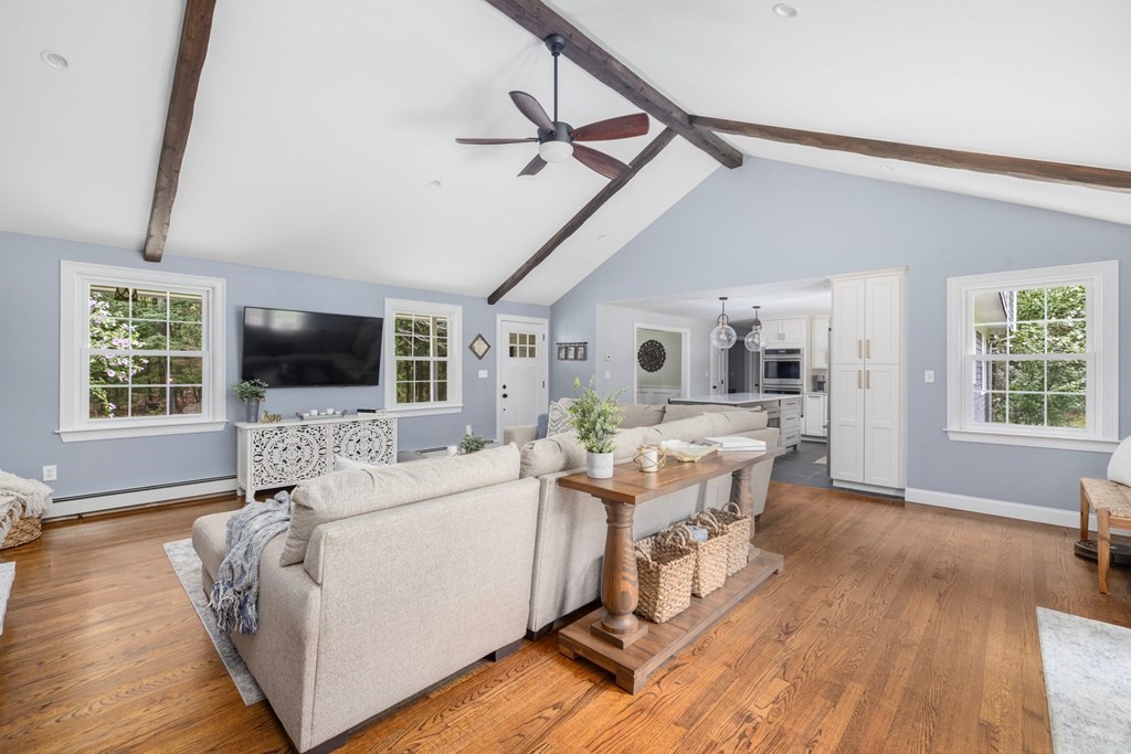 164 Rocky Hill Road Rehoboth, MA 02769 - Photo 17 of 42 a living room with furniture fireplace and a flat screen tv