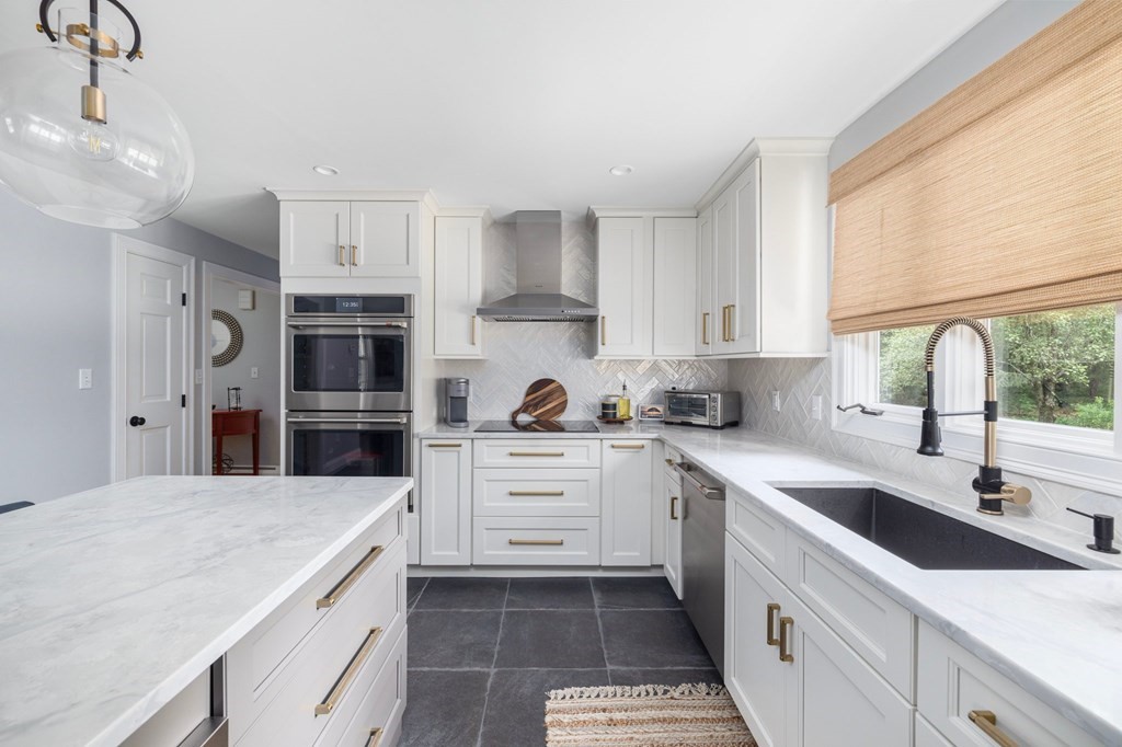 164 Rocky Hill Road Rehoboth, MA 02769 - Photo 20 of 42 a kitchen with a sink a stove a refrigerator and cabinets