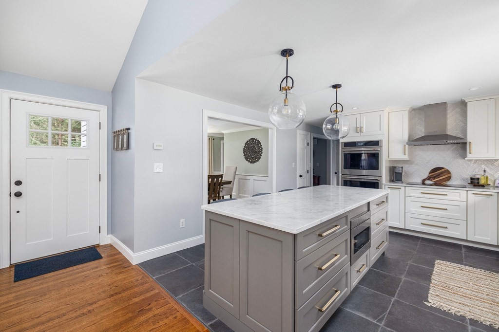 164 Rocky Hill Road Rehoboth, MA 02769 - Photo 21 of 42 a kitchen with a sink a stove and cabinets