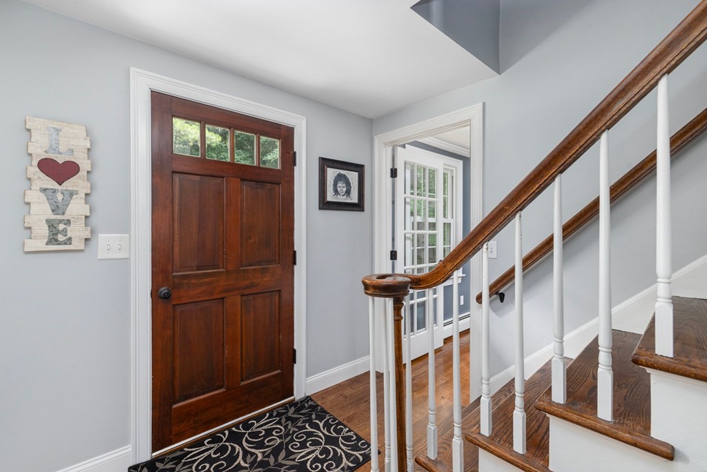 164 Rocky Hill Road Rehoboth, MA 02769 - Photo 25 of 42 a view of entryway with wooden floor and stairs