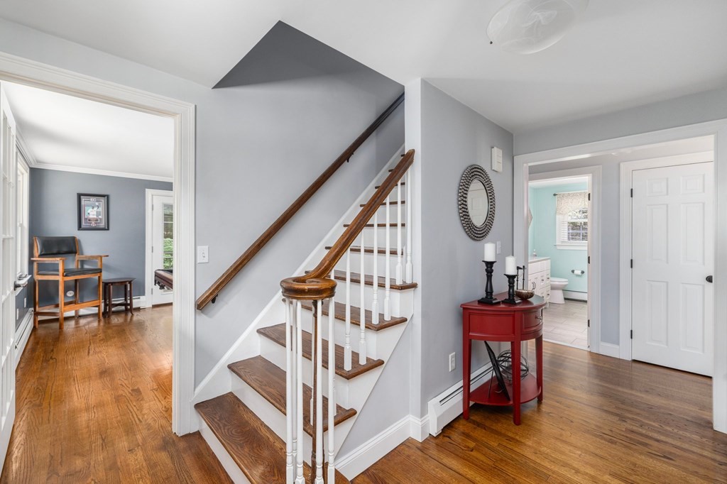 164 Rocky Hill Road Rehoboth, MA 02769 - Photo 26 of 42 a view of entryway dining room and hall with wooden floor