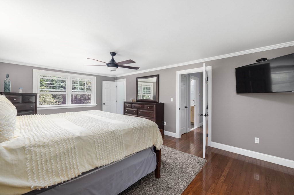 164 Rocky Hill Road Rehoboth, MA 02769 - Photo 34 of 42 a spacious bedroom with a large bed and a flat tv screen