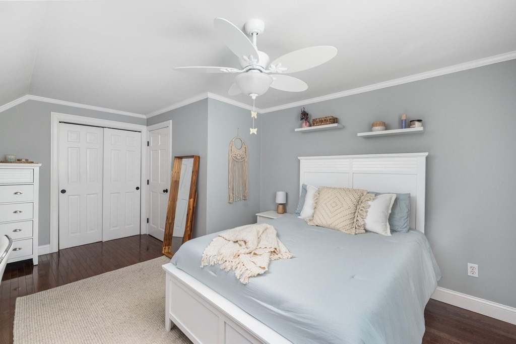 164 Rocky Hill Road Rehoboth, MA 02769 - Photo 37 of 42 a bedroom with a bed and a chandelier