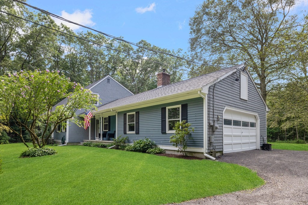 164 Rocky Hill Road Rehoboth, MA 02769 - Photo 4 of 42 a front view of a house with a garden