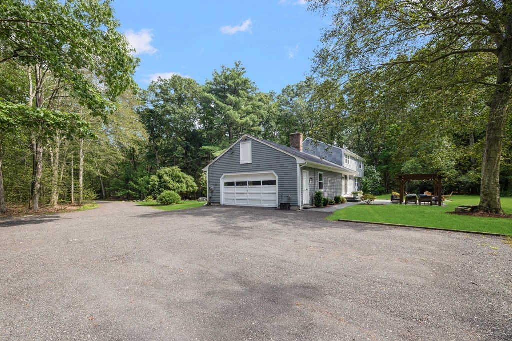 164 Rocky Hill Road Rehoboth, MA 02769 - Photo 5 of 42 a house with trees in the background