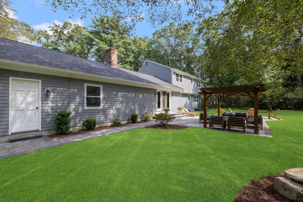 164 Rocky Hill Road Rehoboth, MA 02769 - Photo 6 of 42 a view of a house with a patio and a yard