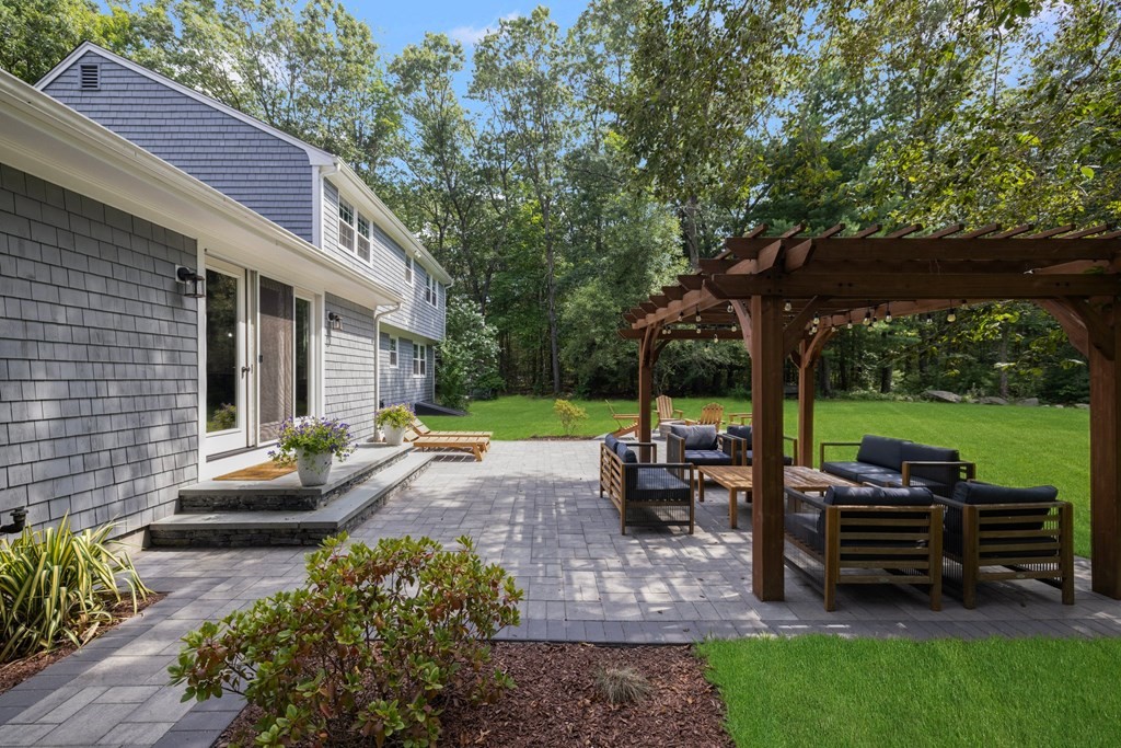 164 Rocky Hill Road Rehoboth, MA 02769 - Photo 7 of 42 a view of a patio with table and chairs potted plants with large tree