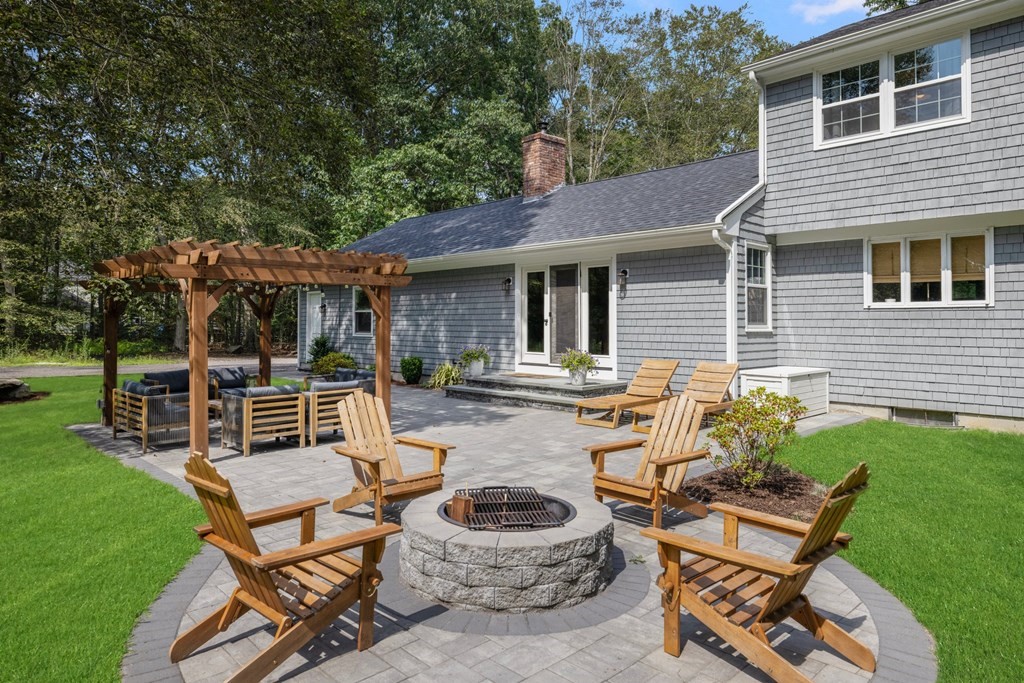 164 Rocky Hill Road Rehoboth, MA 02769 - Photo 9 of 42 a view of a patio with a chairs and table in a patio