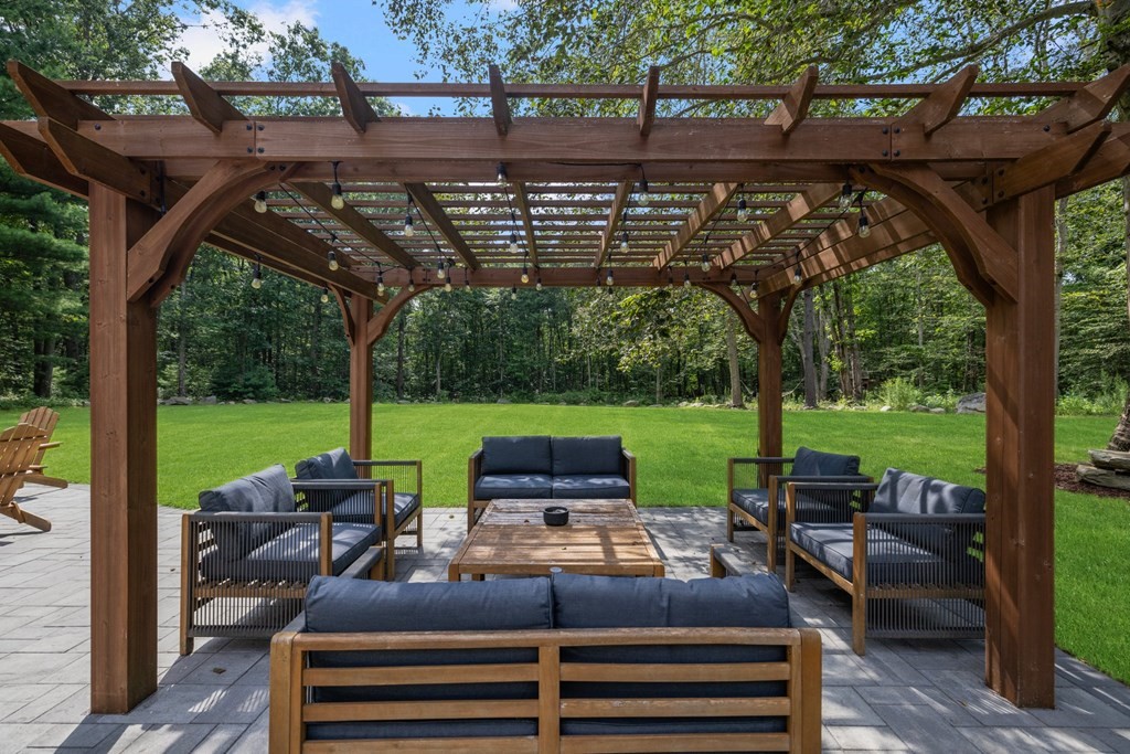 164 Rocky Hill Road Rehoboth, MA 02769 - Photo 10 of 42 a view of a swimming pool with a patio