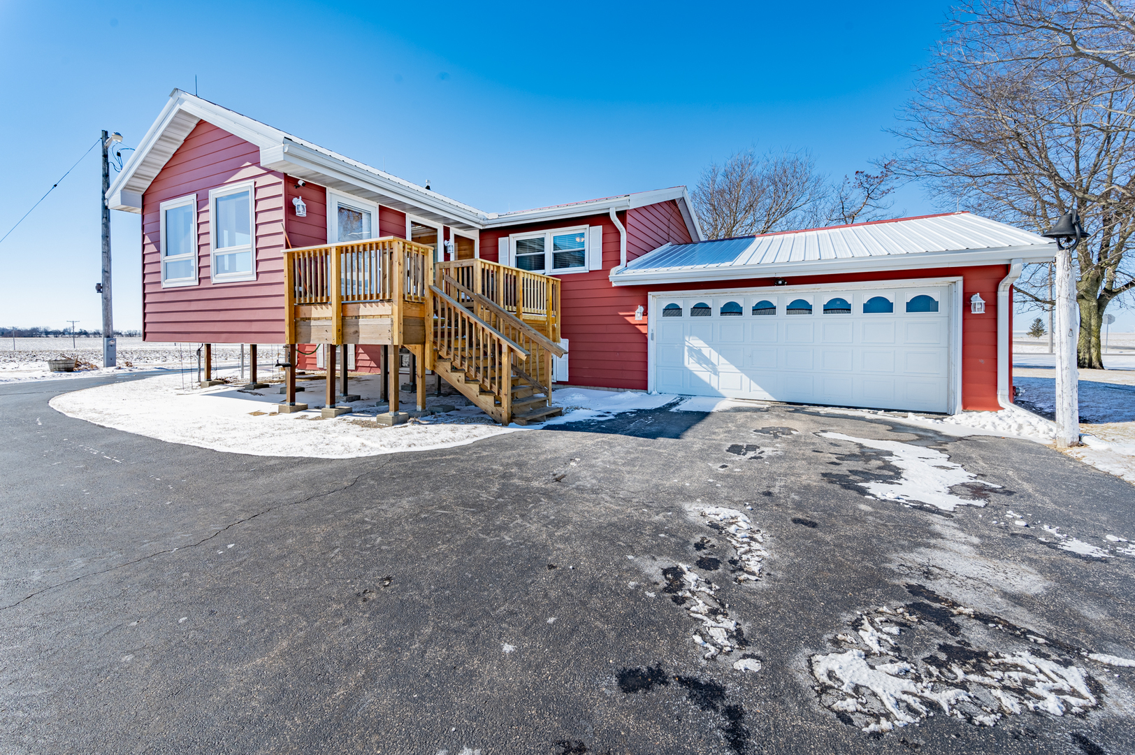 10986 Waterman Road Waterman, IL 60556 - Photo 5 of 34 a front view of a house with a yard