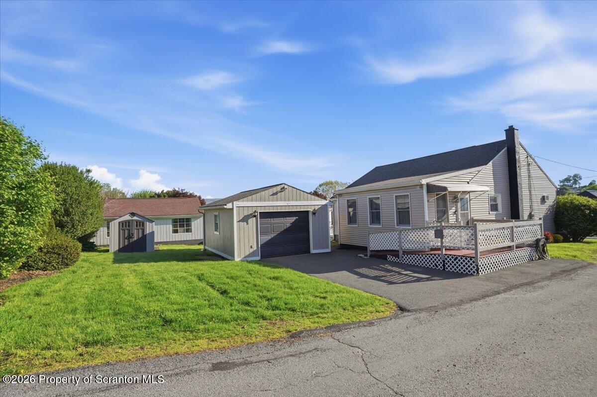 101 Stone Street Moosic, PA 18507 - Photo 39 of 53 a front view of a house with a garden and trees
