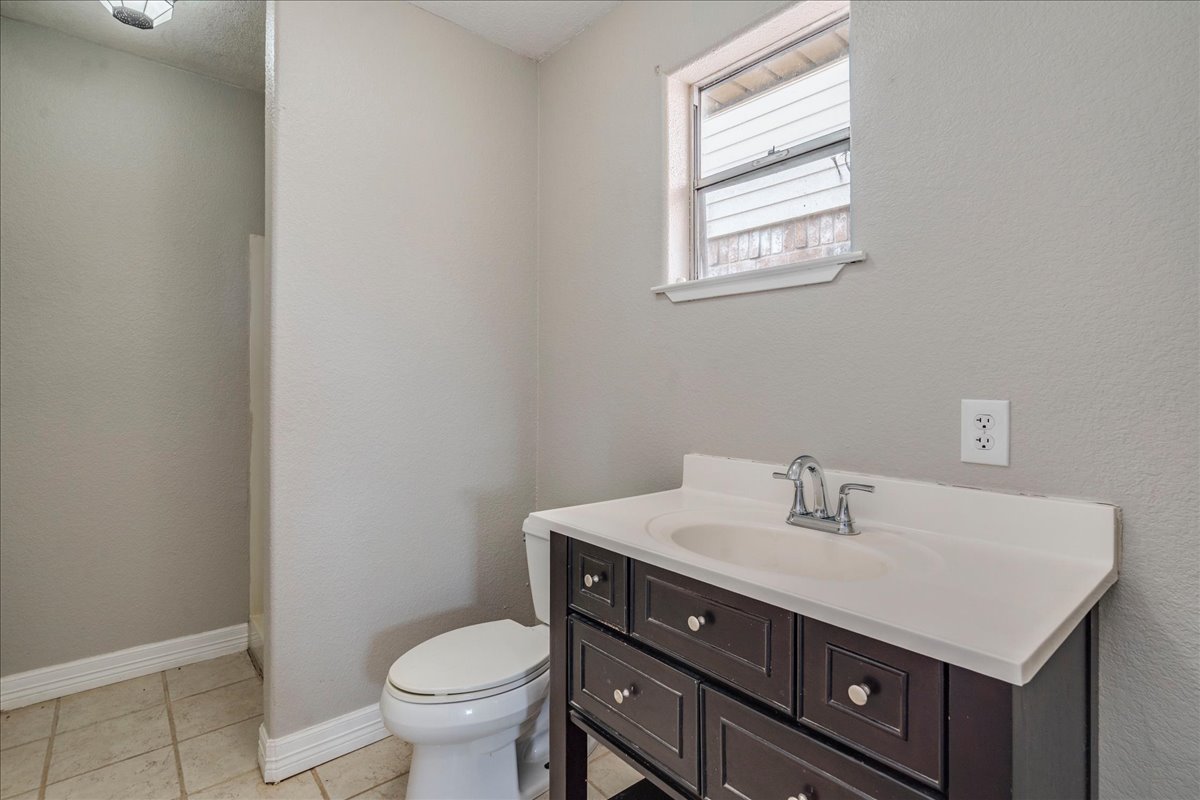 595 Cardinal Road Rosanky, TX 78953 - Photo 28 of 39 a bathroom with a sink vanity and toilet