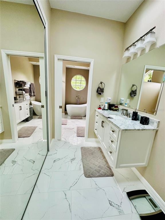784 South Pennsylvania Avenue Winter Park, FL 32789 - Photo 23 of 29 a bedroom with a bed and a mirror