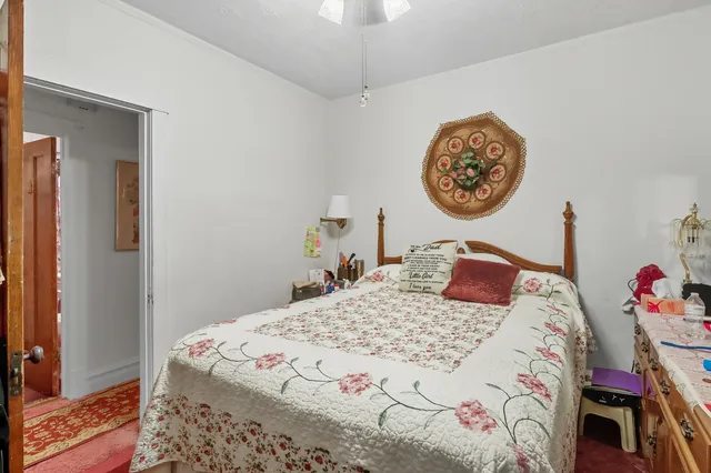 a bedroom with a bed and a table in it