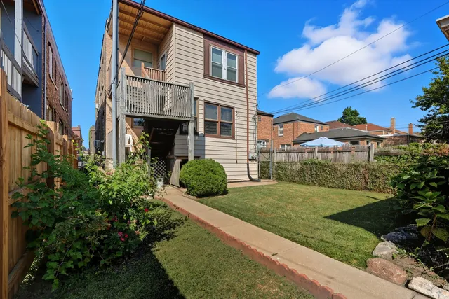 a view of a backyard of the house