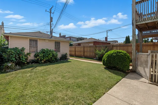 a view of a house with a yard and plants
