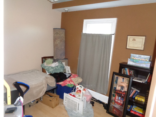 415 May Street Rockford, IL 61104 - Photo 12 of 13 a living room with furniture and a baby crib