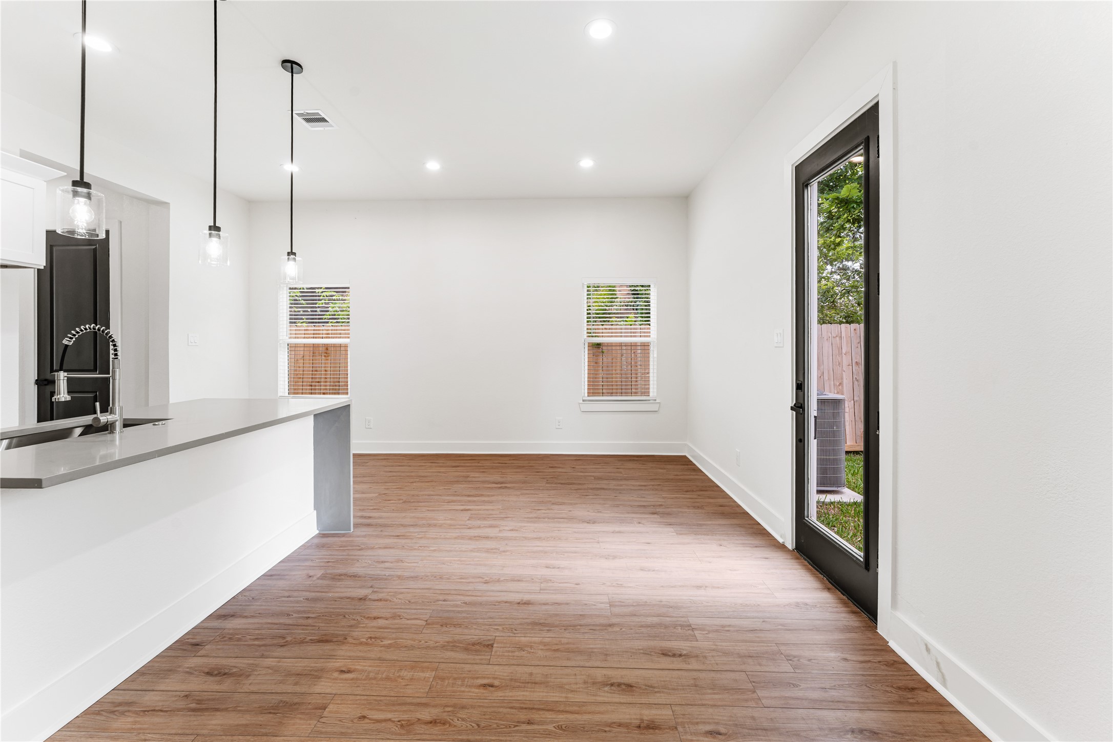 3620 Mt Pleasant Street, Unit A Houston, TX 77021 - Photo 8 of 23 a view of a kitchen with wooden floor and a window