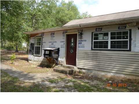 5953 Ridgecrest Road Crestview, FL 32539 - Photo 1 of 27 a view of house with backyard of the house