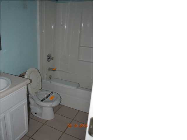 5953 Ridgecrest Road Crestview, FL 32539 - Photo 18 of 27 a bathroom with a sink and a toilet