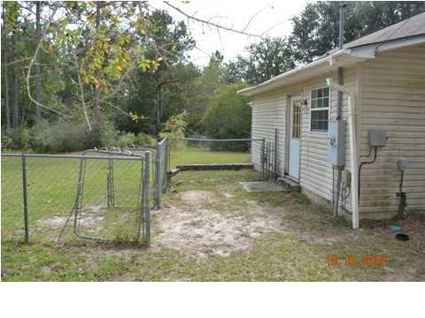 5953 Ridgecrest Road Crestview, FL 32539 - Photo 21 of 27 a backyard of a house with barbeque oven