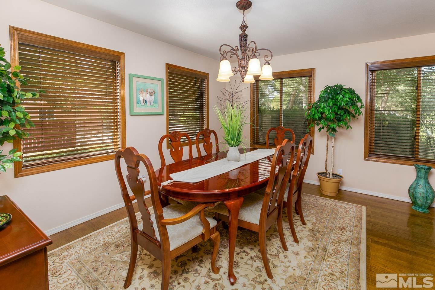 5586 Rivers Edge Drive Fallon, NV 89406 - Photo 13 of 40 a view of a dining room with furniture window and wooden floor