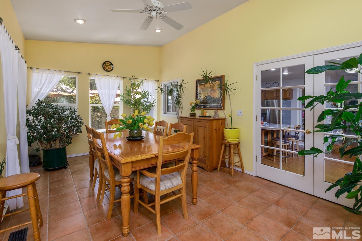 5586 Rivers Edge Drive Fallon, NV 89406 - Photo 14 of 40 a view of a dining room with furniture and chandelier