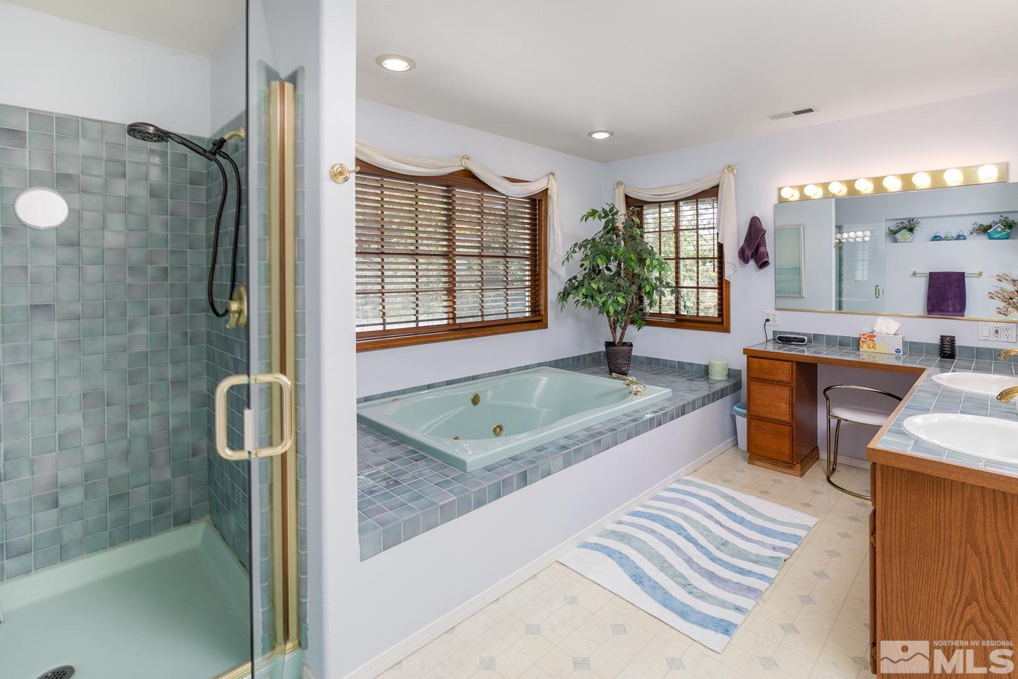 5586 Rivers Edge Drive Fallon, NV 89406 - Photo 18 of 40 a large spacious bathroom with a granite countertop tub shower and sink