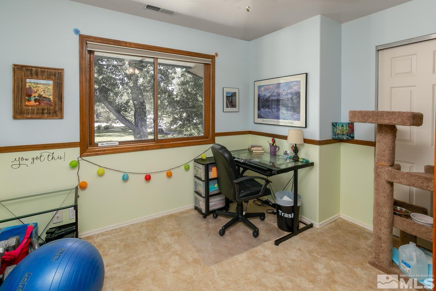 5586 Rivers Edge Drive Fallon, NV 89406 - Photo 20 of 40 a view of a workspace with furniture and a window
