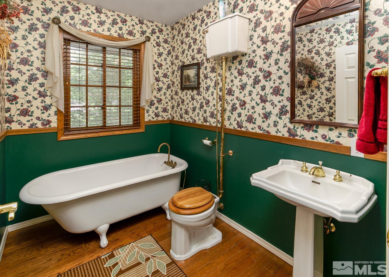 5586 Rivers Edge Drive Fallon, NV 89406 - Photo 25 of 40 a bathroom with a sink toilet and mirror