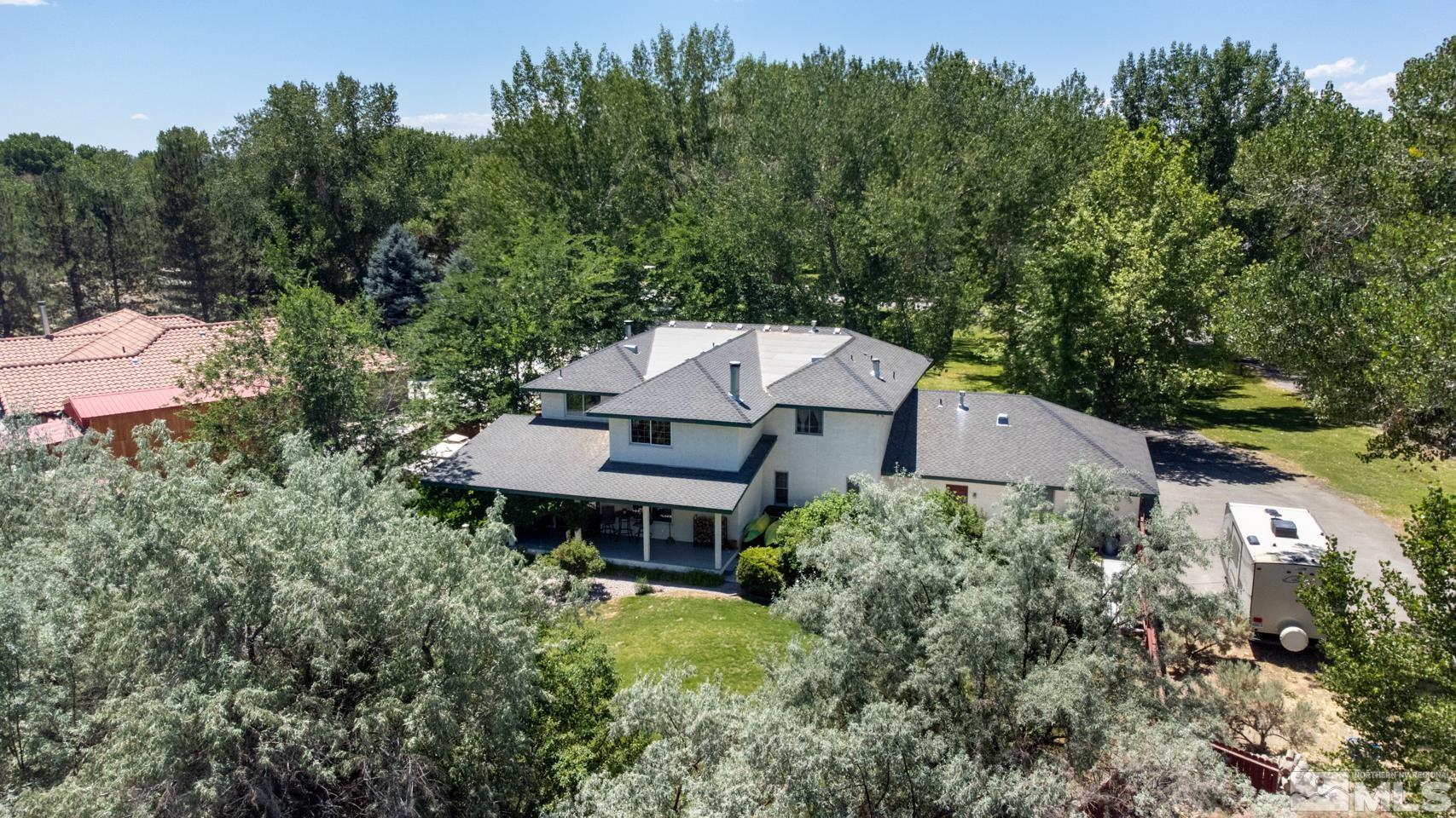 5586 Rivers Edge Drive Fallon, NV 89406 - Photo 30 of 40 an aerial view of a house with a yard table and chairs