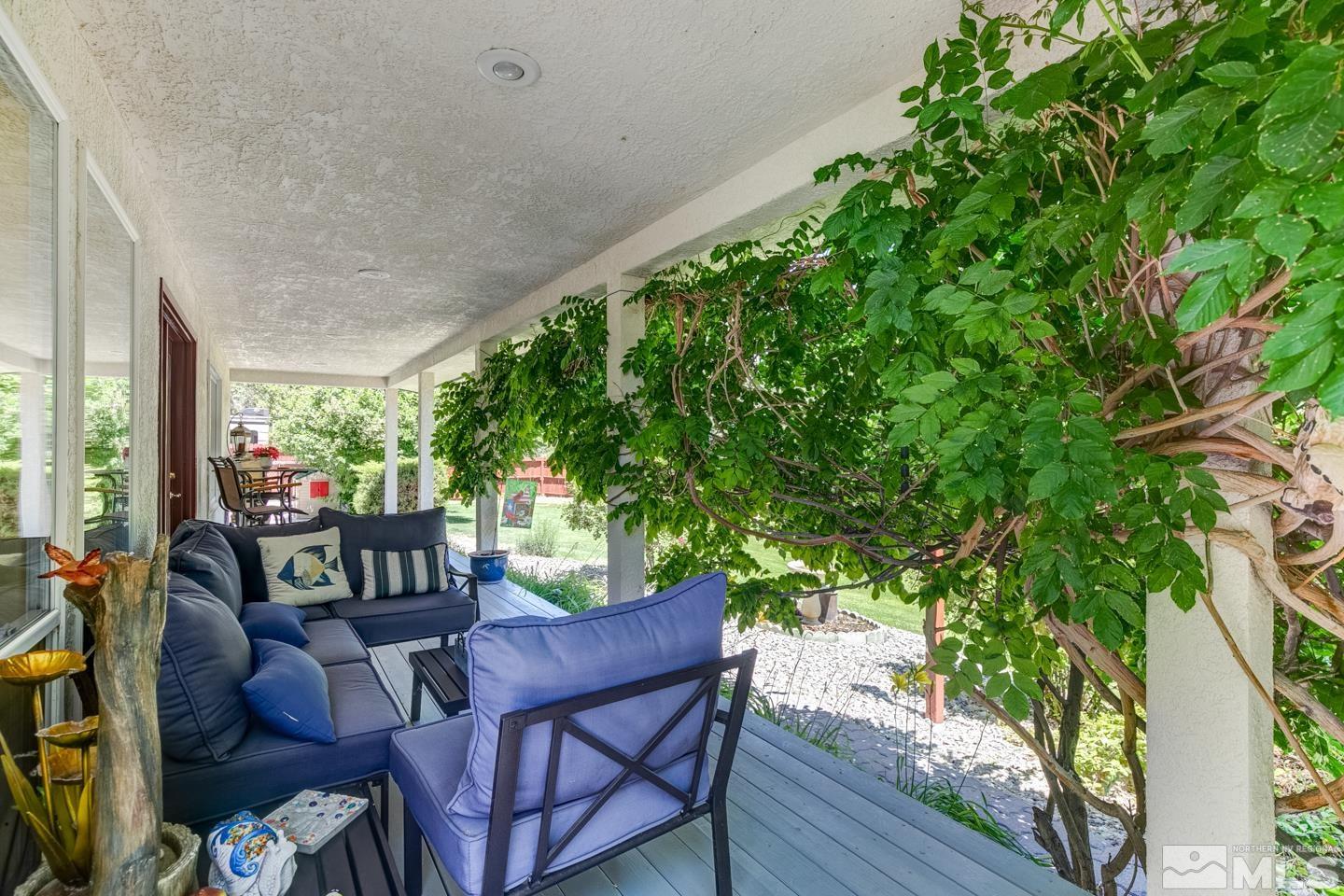 5586 Rivers Edge Drive Fallon, NV 89406 - Photo 36 of 40 a view of a chairs and table in a patio