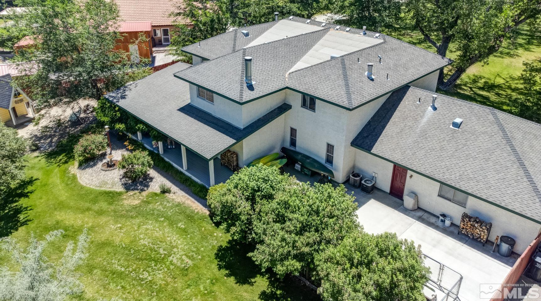 5586 Rivers Edge Drive Fallon, NV 89406 - Photo 39 of 40 an aerial view of a house with a yard and large tree