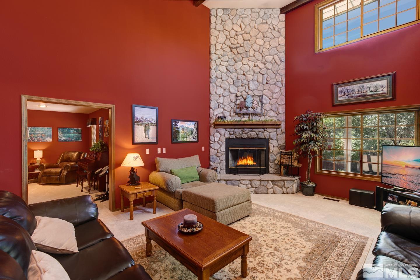 5586 Rivers Edge Drive Fallon, NV 89406 - Photo 5 of 40 a living room with furniture a rug and a fireplace