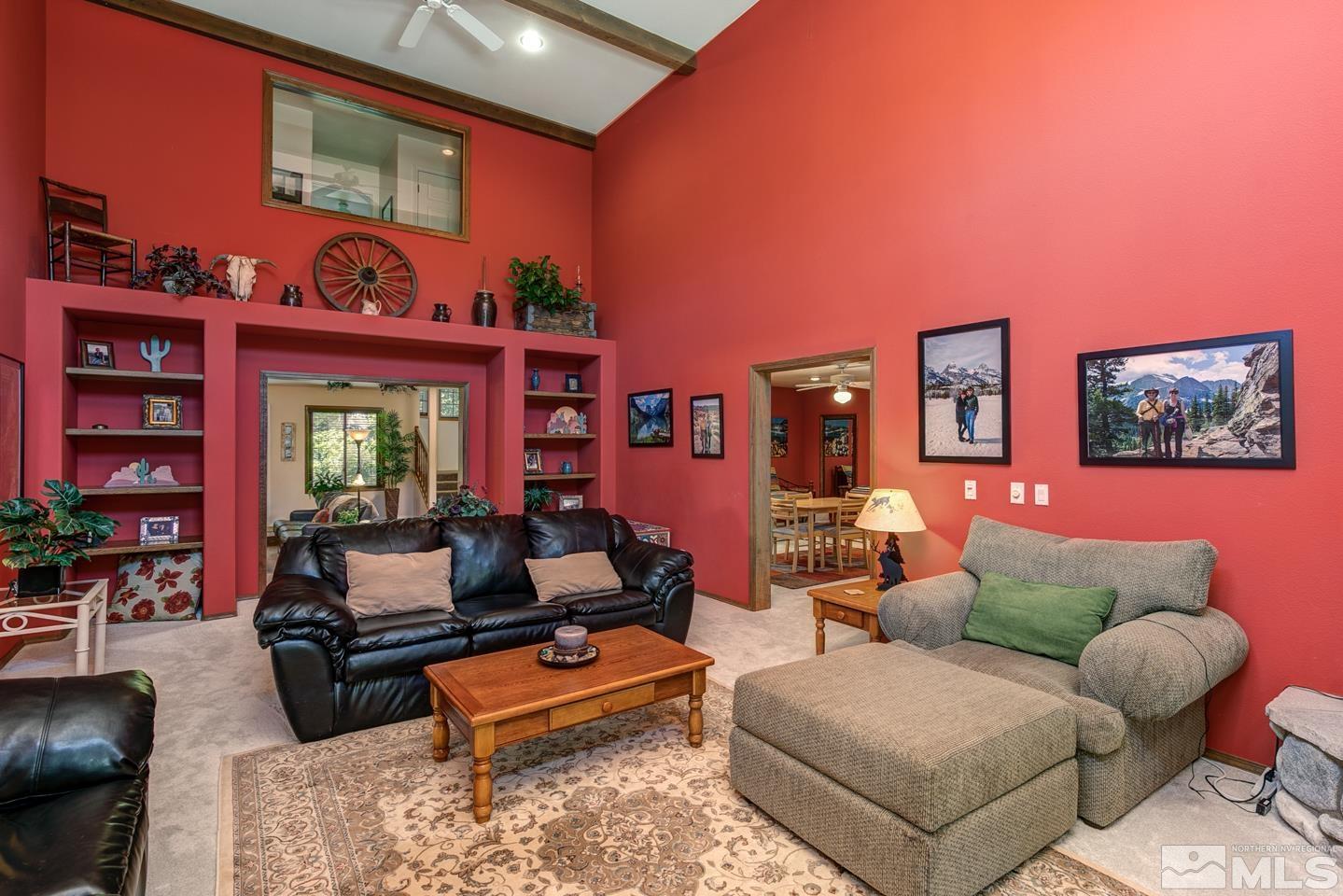 5586 Rivers Edge Drive Fallon, NV 89406 - Photo 6 of 40 a living room with furniture a rug and a floor to ceiling window