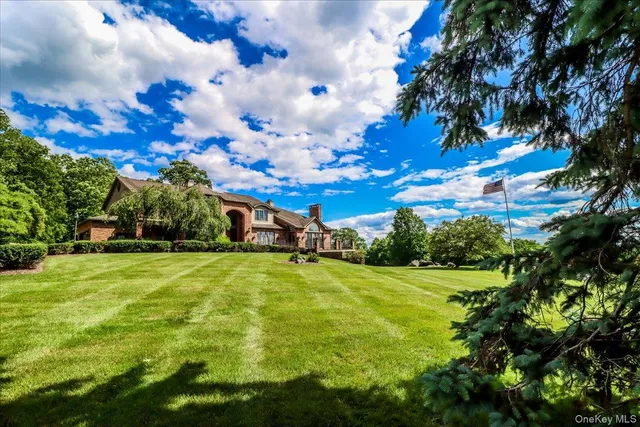 a yellow building in the middle of a field