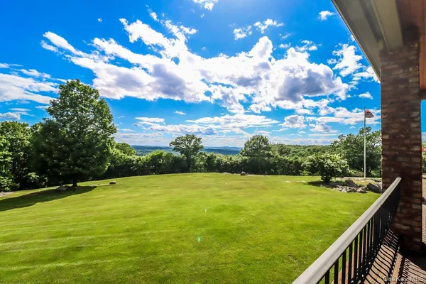 a view of swimming pool from a balcony
