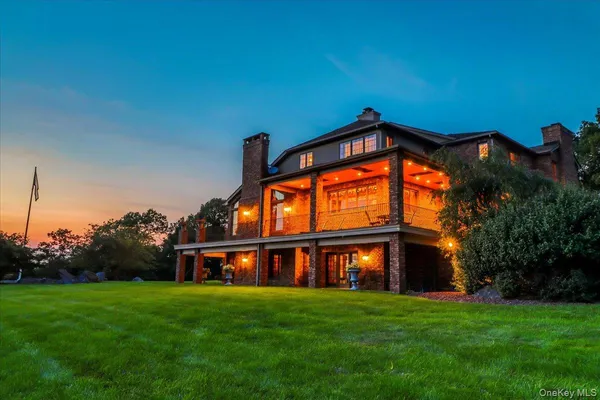 a view of a big house with a big yard