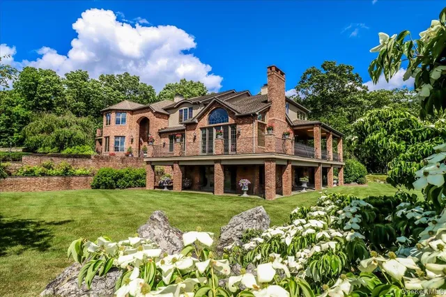 a front view of a house with a big yard