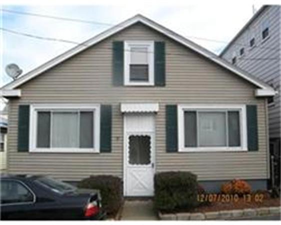 7 Bay Road Revere, MA 02151 - Photo 2 of 5 a front view of a house with garage