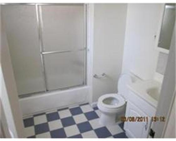 7 Bay Road Revere, MA 02151 - Photo 4 of 5 a bathroom with a black and white checkered floor