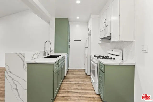 a view of an empty room and wooden floor